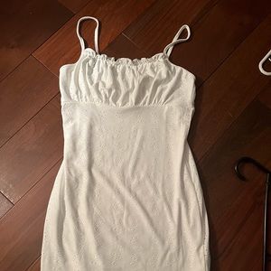 Ann Marie’s Boutique/Tag. Mini, tight, white flower printed dress. Small